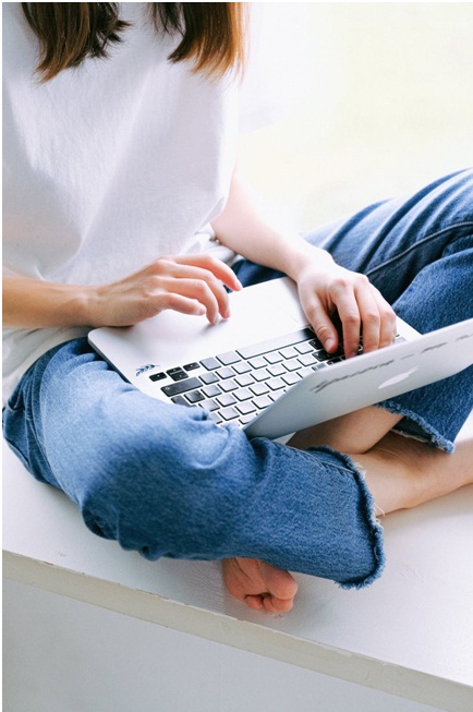 Macbook on a women's lap