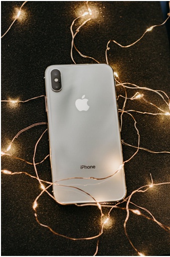 iPhone on the floor with lights around it