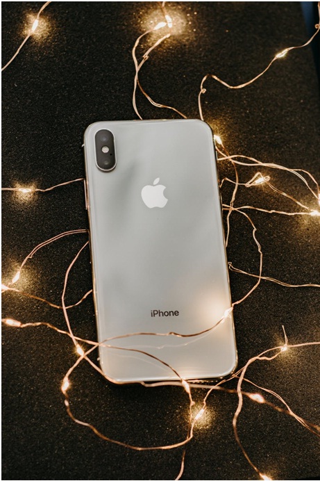 iPhone with lights around it on the floor